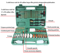 Gun Werka gun cleaning kit with various components including brass rods, jags, mops, brushes, and adapters, neatly organized in a green plastic case.