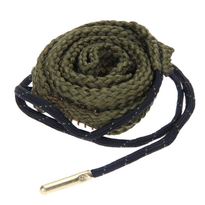 Loosely coiled 38 caliber Bore Viper cleaning rope that is made with green braided cotton threads on a white background