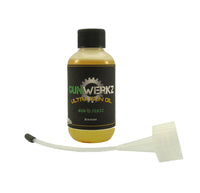 Bottle of Gun Werkz Ultra Gun Oil with spout applicator on a white background