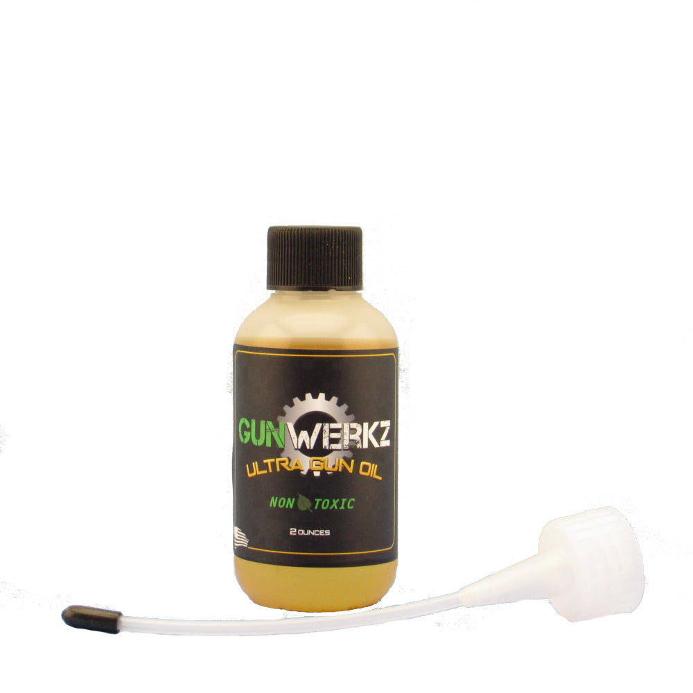 Bottle of Gun Werkz Ultra Gun Oil with spout applicator on a white background