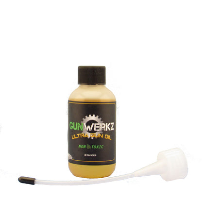 Bottle of Gun Werkz Ultra Gun Oil with spout applicator on a white background