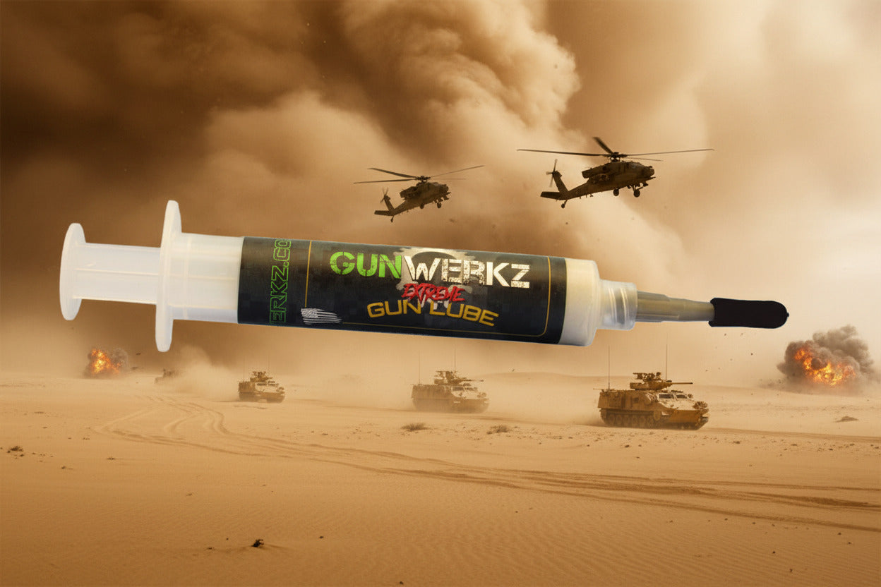 One third ounce syringe with high temperature Gun Werkz Extreme grease on a desert storm background with helicopters in the air and tanks on the ground with explosions in the distance