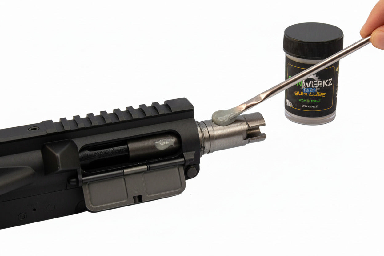 person lubricating the upper of an AR-15 with GunWerkz Ultra Gun Lube